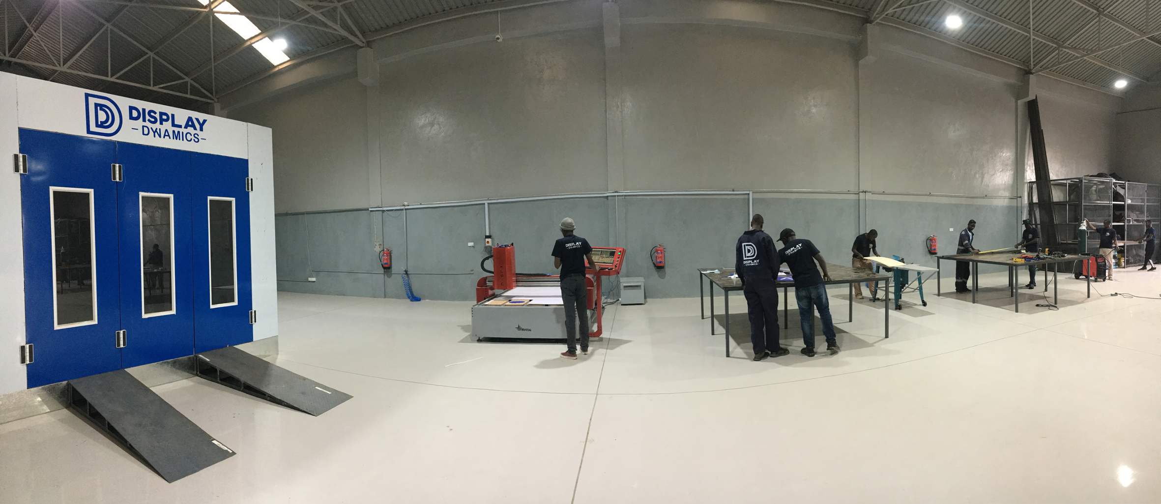 The Display Dynamics factory floor in Nairobi, with the team working at fabrication stations
